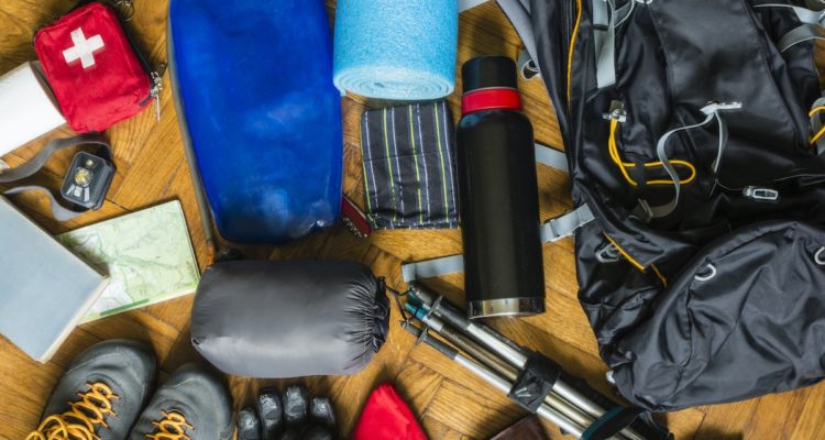 backpacking gear laid out on the floor