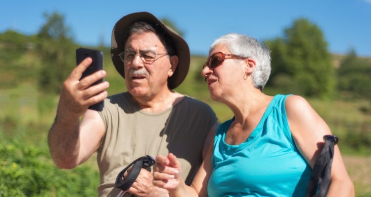 man and woman looking at a phone